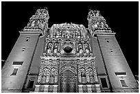 Illuminated facade of Cathdedral laced with Churrigueresque carvings at night. Zacatecas, Mexico ( black and white)