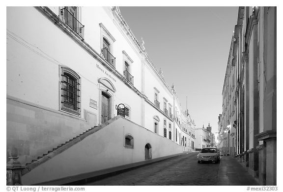 Car in street at dawn with Zacatecas Museum. Zacatecas, Mexico