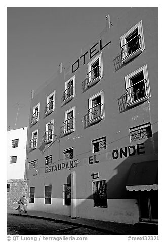 Hotel restaurant building painted bright blue and yellow. Guanajuato, Mexico