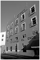Hotel restaurant building painted bright blue and yellow. Guanajuato, Mexico (black and white)