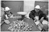 Men with cow-boy hats selling strawberries. Guanajuato, Mexico (black and white)