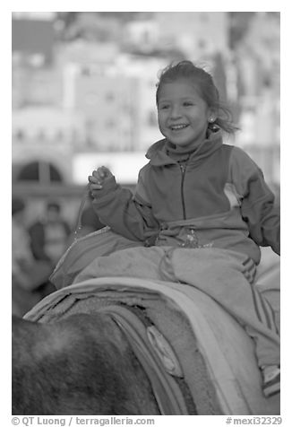 Girl riding a donkey. Guanajuato, Mexico