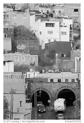Houses on a hillside built above a tunnel. Guanajuato, Mexico (black and white)