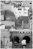 Houses on a hillside built above a tunnel. Guanajuato, Mexico (black and white)