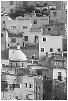 Houses painted with bright colors on a steep hillside. Guanajuato, Mexico (black and white)