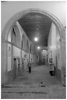 Man walking in an arched passage a dawn. Guanajuato, Mexico (black and white)