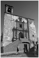 People walking in front of church San Roque, early morning. Guanajuato, Mexico (black and white)