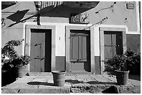 Blue doors and yellow wall on Plaza San Roque. Guanajuato, Mexico ( black and white)