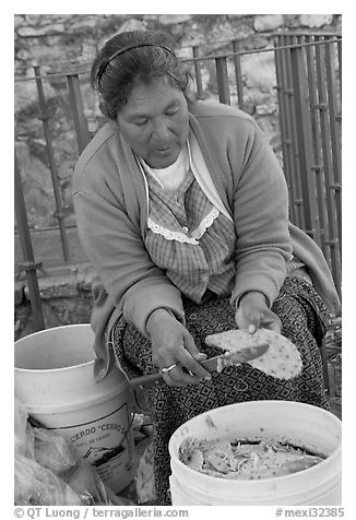 Woman peeling cactus. Guanajuato, Mexico