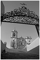Forged metal gate and La Valenciana church. Guanajuato, Mexico (black and white)