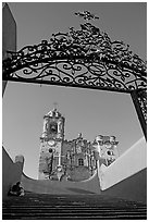 Forged metal gate and La Valenciana church. Guanajuato, Mexico (black and white)