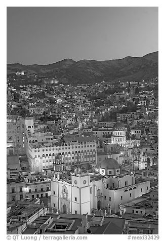 Panoramic view of the historic town with illuminated basilic, university, and La Compania. Guanajuato, Mexico (black and white)