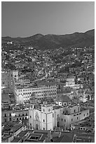 Panoramic view of the historic town with illuminated basilic, university, and La Compania. Guanajuato, Mexico (black and white)