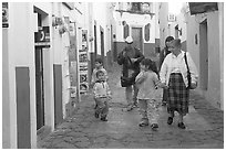 Family walking down an alley. Guanajuato, Mexico (black and white)