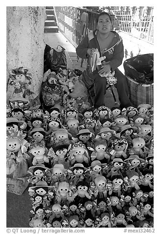 Woman selling Traditional puppets. Guanajuato, Mexico (black and white)