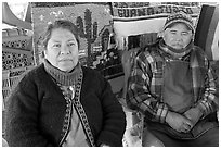 Couple sitting in front of carpets. Guanajuato, Mexico (black and white)