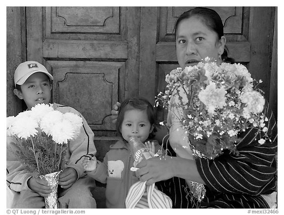 Woman with two children sitting in doorway. Guanajuato, Mexico (black and white)