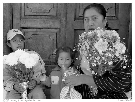 Woman with two children sitting in doorway. Guanajuato, Mexico