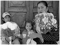 Woman with two children sitting in doorway. Guanajuato, Mexico (black and white)