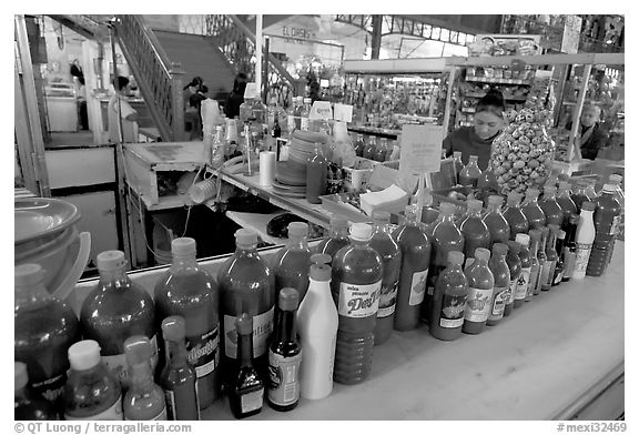 Chili bottles at a booth in Mercado Hidalgo. Guanajuato, Mexico (black and white)