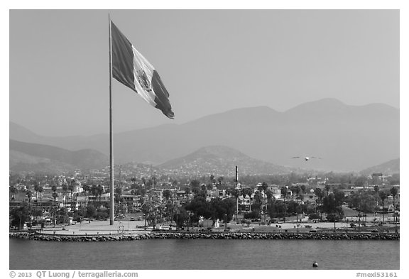 Giean Mexican national flag flying above Malecon, Ensenada. Baja California, Mexico (black and white)