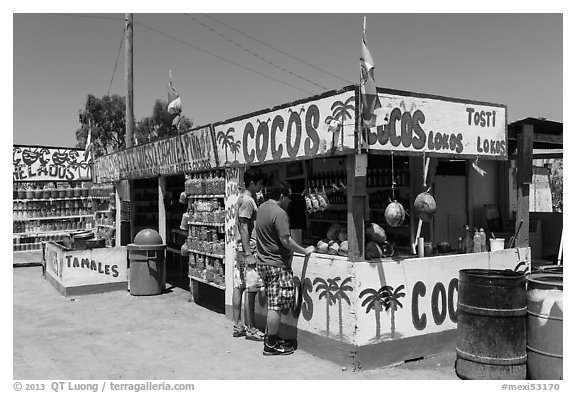 Customers at food stand. Baja California, Mexico (black and white)