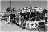 Customers at food stand. Baja California, Mexico (black and white)