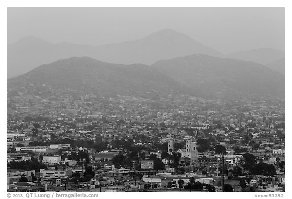 Distant view of Ensendada spreading up hills at sunset. Baja California, Mexico