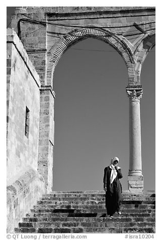 Muslim woman on stairs at the Dome of the Rock entrance. Jerusalem, Israel