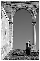 Muslim woman on stairs at the Dome of the Rock entrance. Jerusalem, Israel (black and white)