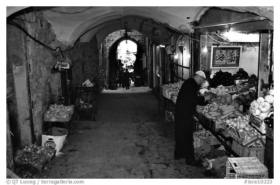 Fruit and vegetable store in an old town archway. Jerusalem, Israel (black and white)
