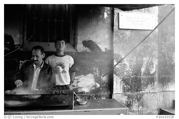 Food vendor broiling meat. Jerusalem, Israel (black and white)