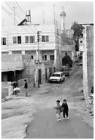 Two schoolchildren in a street of East Jerusalem. Jerusalem, Israel (black and white)