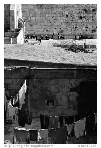Laundry in a courtyard, with the Western Wall in the background. Jerusalem, Israel (black and white)