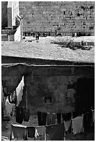 Laundry in a courtyard, with the Western Wall in the background. Jerusalem, Israel ( black and white)