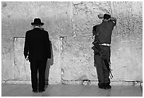 Orthodox Jew and soldier at the Western Wall. Jerusalem, Israel ( black and white)
