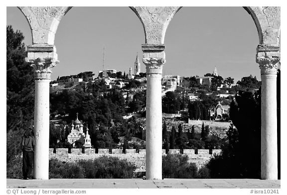 Spires and Mount of Olives seen through arches. Jerusalem, Israel (black and white)