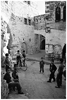 Group of children in old street, Hebron. West Bank, Occupied Territories (Israel) (black and white)