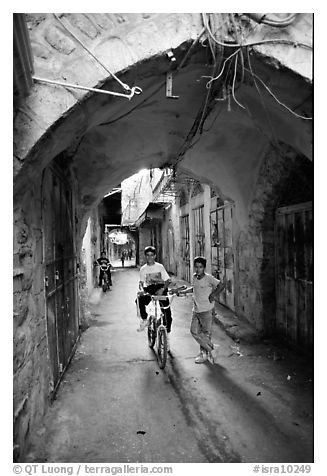 Two children under an archway, Hebron. West Bank, Occupied Territories (Israel) (black and white)