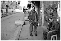 Two young israeli soldiers manning a checkpoint, Hebron. West Bank, Occupied Territories (Israel) (black and white)