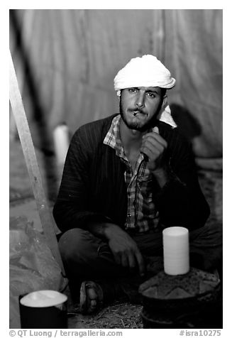 Bedouin man in a tent, Judean Desert. West Bank, Occupied Territories (Israel) (black and white)