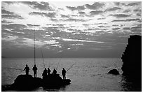 Fishermen standing on a rock, Akko (Acre). Israel ( black and white)