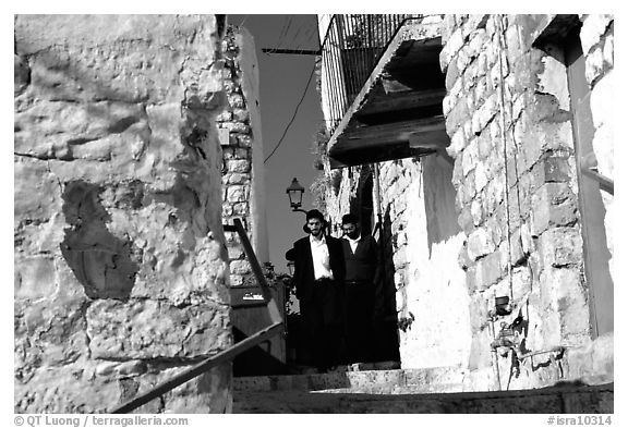 Orthodox jews in a narrow alley, Safed (Tsfat). Israel (black and white)