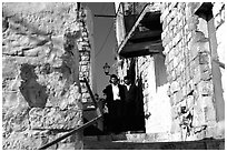 Orthodox jews in a narrow alley, Safed (Tsfat). Israel (black and white)