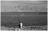 Fishing in the Red Sea, Eilat. Negev Desert, Israel ( black and white)