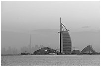 Burj Al Arab and downtown skyline from Palm Jumeira. United Arab Emirates ( black and white)