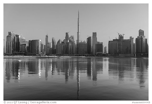 Downtown skyline reflected in Dubai Creek. United Arab Emirates (black and white)