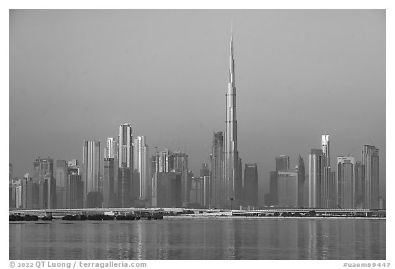Dubai skyline with Burj Khalifa reflected in Dubai Creek. United Arab Emirates