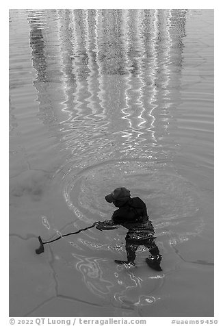 Working cleaning Burj Khalifa fountains. United Arab Emirates (black and white)