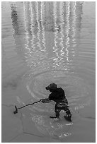 Working cleaning Burj Khalifa fountains. United Arab Emirates ( black and white)